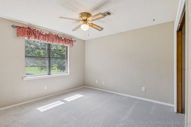 10421 S 197th E Ave, Broken Arrow, OK 74014 - spare room with a textured wall, a ceiling fan, carpet, and a textured ceiling