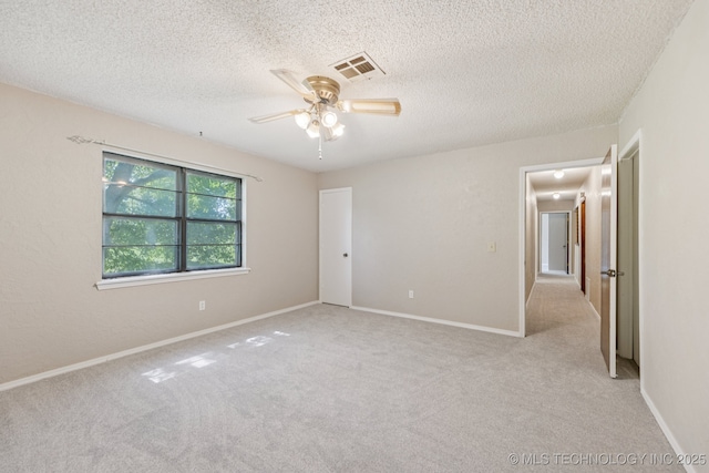 10421 S 197th E Ave, Broken Arrow, OK 74014 - spare room with a ceiling fan, light colored carpet, and a textured ceiling