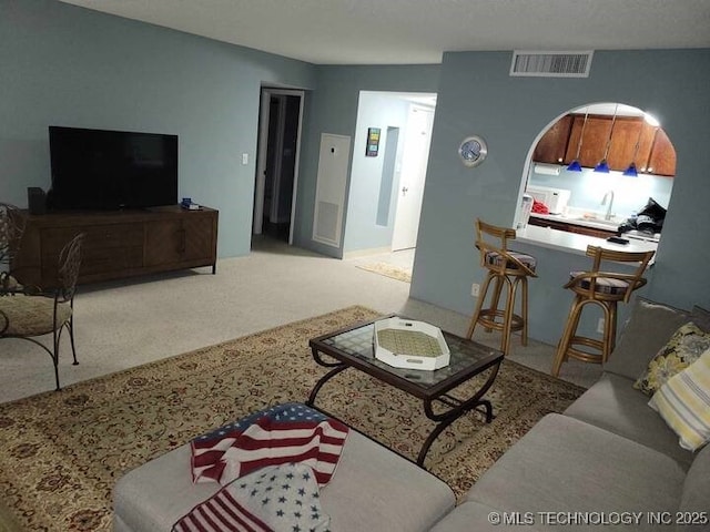 450 W 7th St Unit 704, Tulsa, OK 74119 - carpeted living area with a sink