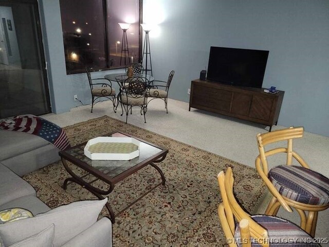 450 W 7th St Unit 704, Tulsa, OK 74119 - living area with carpet floors