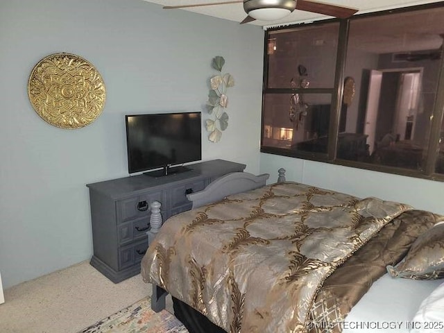 450 W 7th St Unit 704, Tulsa, OK 74119 - carpeted bedroom featuring a ceiling fan