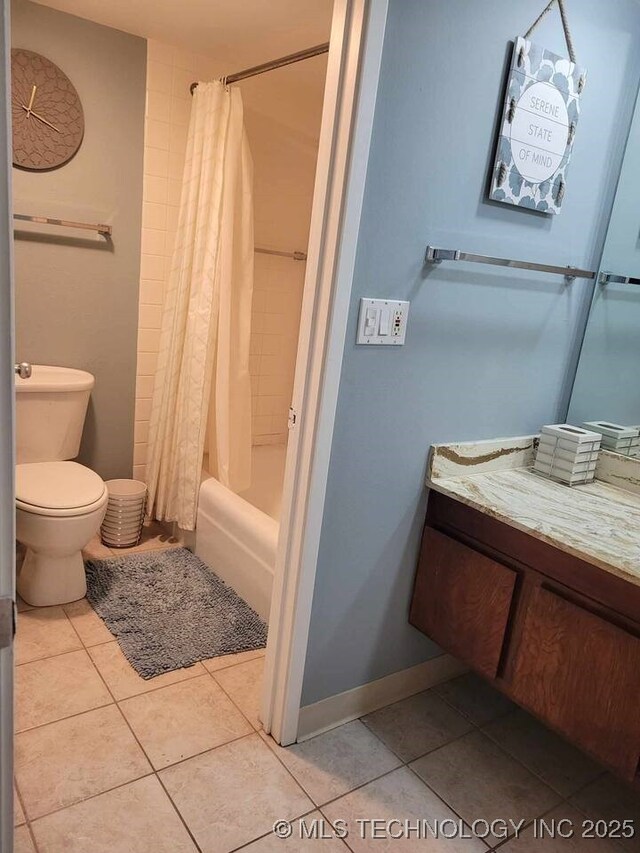 450 W 7th St Unit 704, Tulsa, OK 74119 - bathroom featuring vanity, tile patterned flooring, and shower / tub combo with curtain
