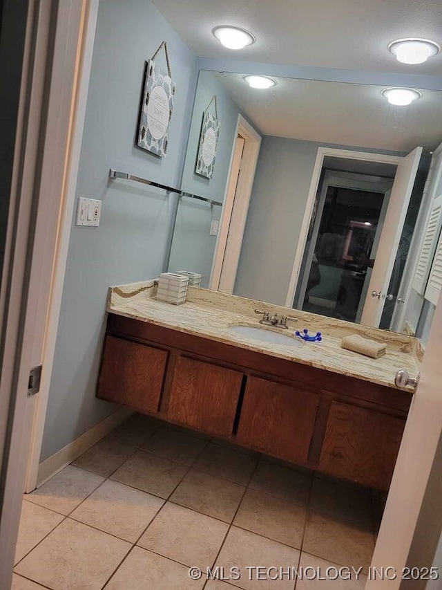 450 W 7th St Unit 704, Tulsa, OK 74119 - bathroom featuring vanity and tile patterned flooring