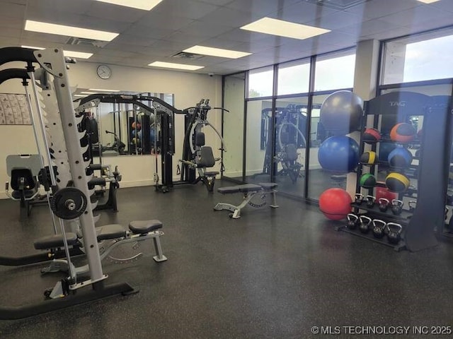 450 W 7th St Unit 704, Tulsa, OK 74119 - exercise room featuring plenty of natural light and a paneled ceiling