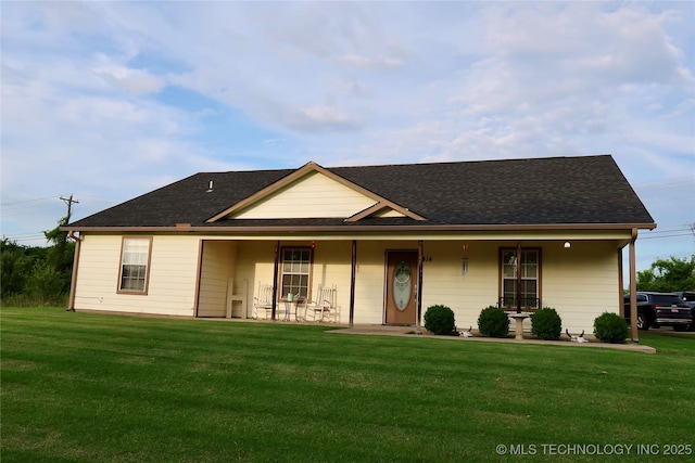 414 Yorktown St, Wagoner, OK 74467 - view of front of house with a front yard, a porch, and roof with shingles