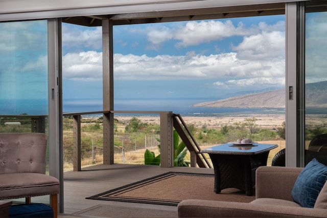 sunroom featuring a mountain view