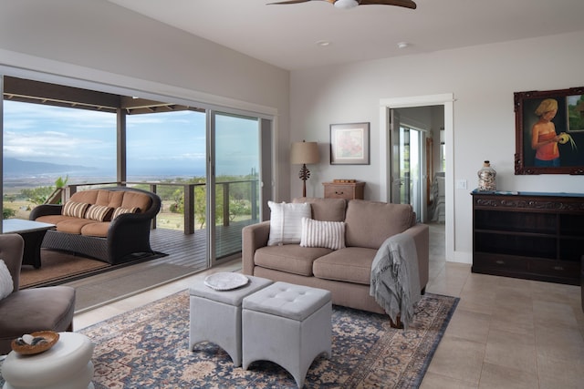 living room with ceiling fan and a mountain view