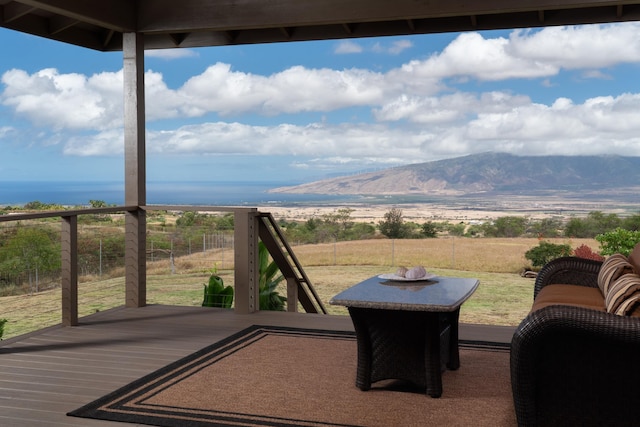 wooden deck with a mountain view