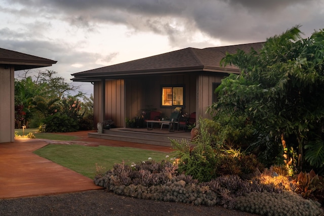 view of outbuilding with a yard