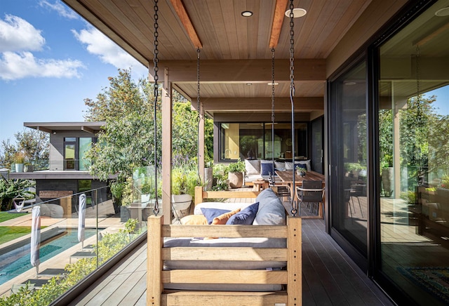 view of patio / terrace with a swimming pool side deck and an outdoor hangout area