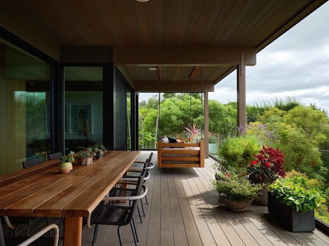 wooden terrace with a porch