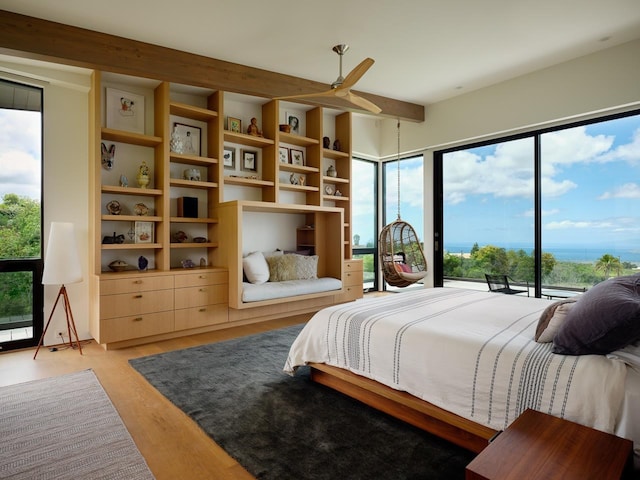 bedroom with ceiling fan and light hardwood / wood-style flooring