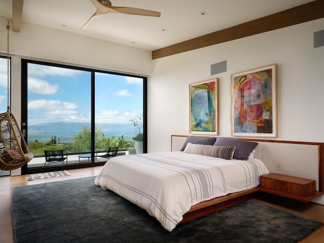 bedroom with access to outside, ceiling fan, hardwood / wood-style floors, and a mountain view