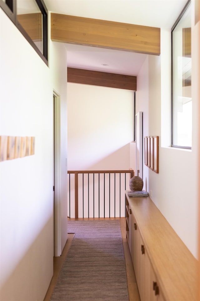 corridor featuring beam ceiling