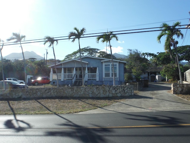 bungalow featuring a mountain view and a porch