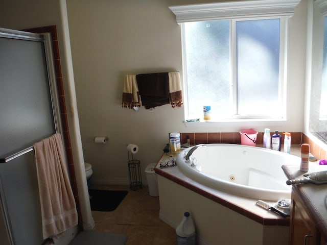 full bathroom featuring vanity, toilet, tile patterned flooring, and shower with separate bathtub