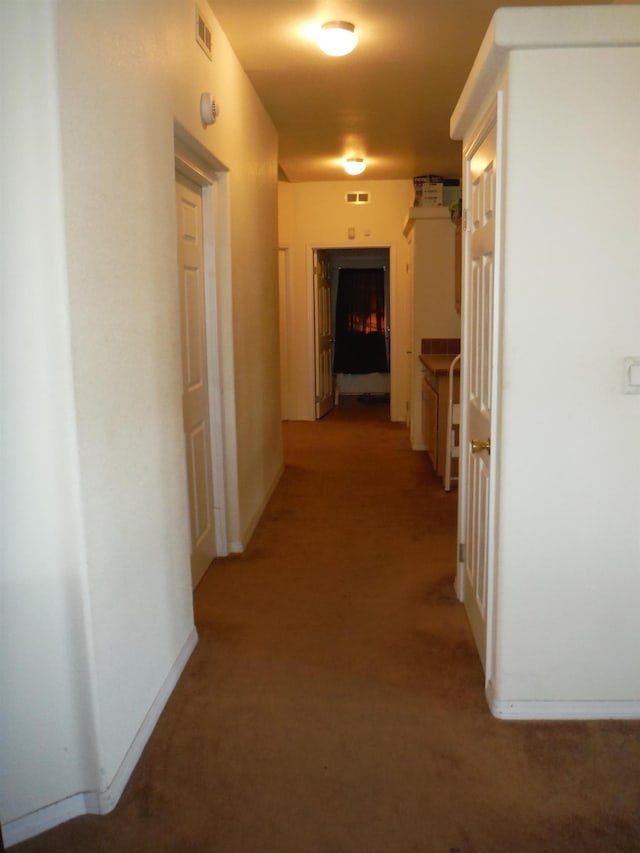 hall with carpet flooring