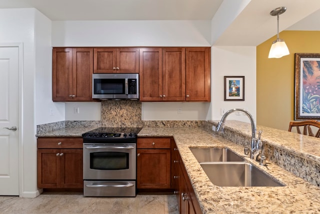 28 Hauwahine Ln Unit F203, Kihei, HI 96753 - kitchen with stainless steel appliances, light stone countertops, decorative light fixtures, and backsplash