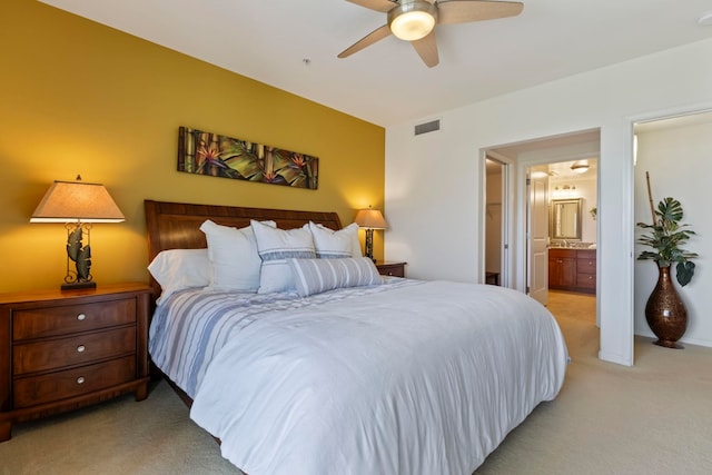 28 Hauwahine Ln Unit F203, Kihei, HI 96753 - bedroom featuring light carpet, ensuite bath, and ceiling fan