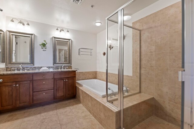 28 Hauwahine Ln Unit F203, Kihei, HI 96753 - full bath featuring double vanity, a stall shower, a bath, and tile patterned flooring