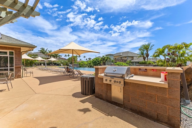 28 Hauwahine Ln Unit F203, Kihei, HI 96753 - view of patio / terrace featuring area for grilling and a swimming pool