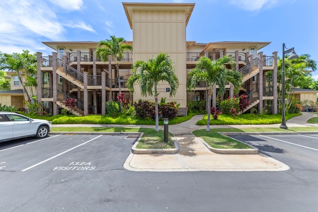 28 Hauwahine Ln Unit F203, Kihei, HI 96753 - view of property with stairs and uncovered parking