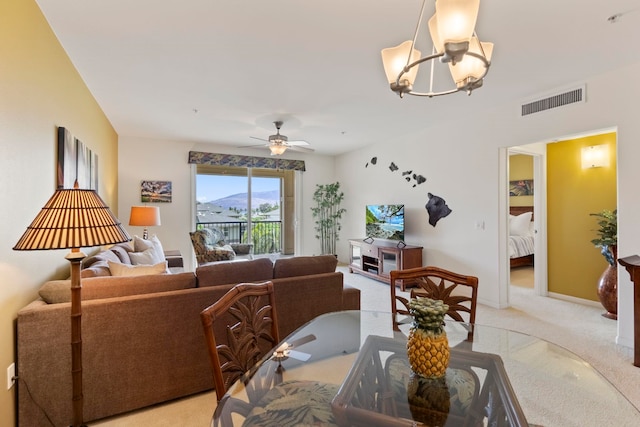 28 Hauwahine Ln Unit F203, Kihei, HI 96753 - dining space featuring light colored carpet, a chandelier, and a ceiling fan