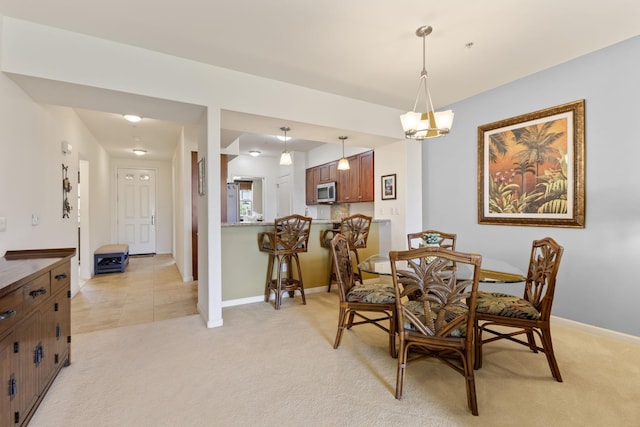 28 Hauwahine Ln Unit F203, Kihei, HI 96753 - dining room with light carpet and baseboards