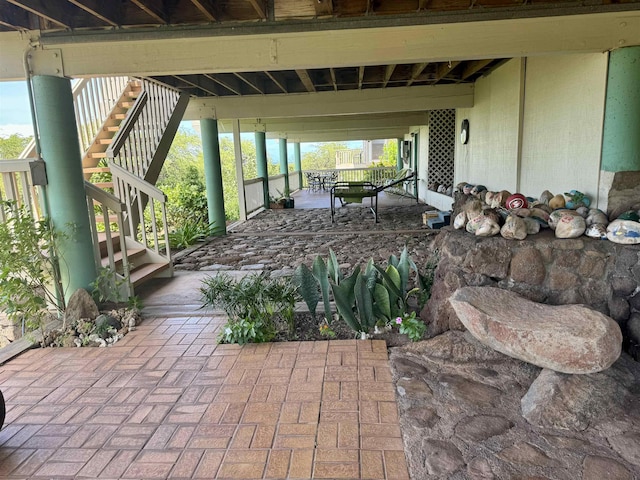 view of patio / terrace featuring stairway