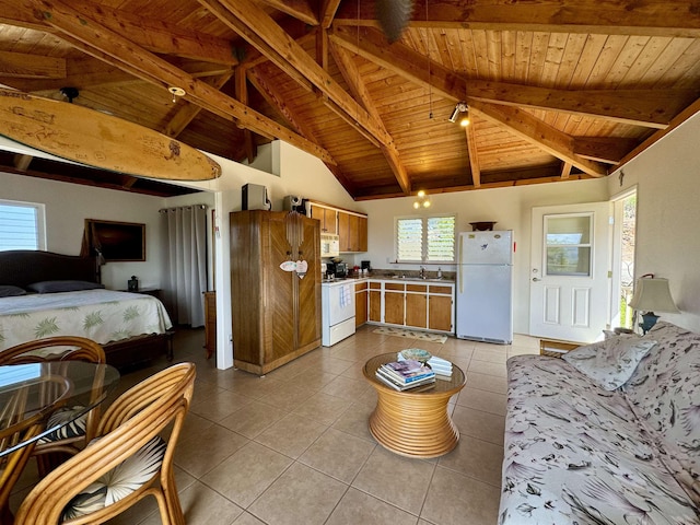 kitchen featuring white appliances, wooden ceiling, a sink, light tile patterned floors, and beamed ceiling