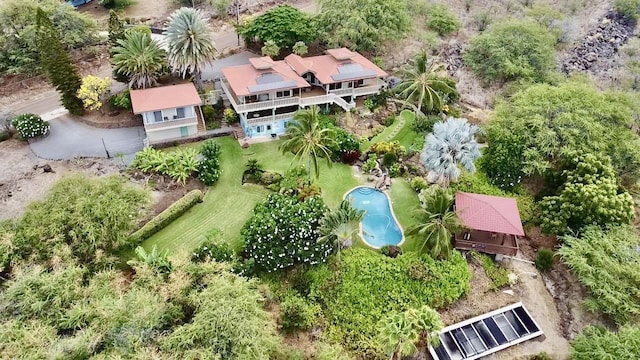 aerial view of property and surrounding area with a pool area
