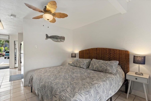 tiled bedroom with ceiling fan and access to exterior