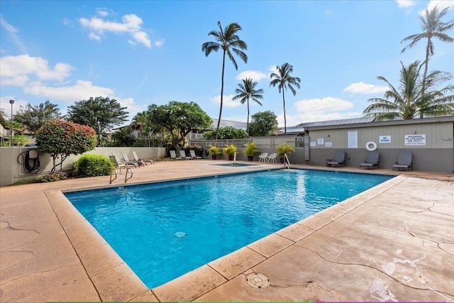 view of swimming pool with a patio