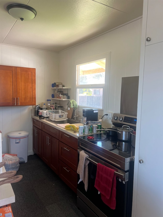 kitchen with stainless steel range with electric stovetop