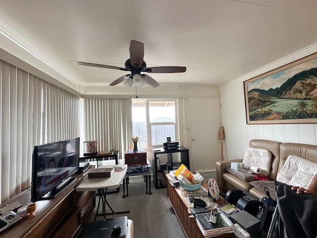 home office with ceiling fan and carpet floors