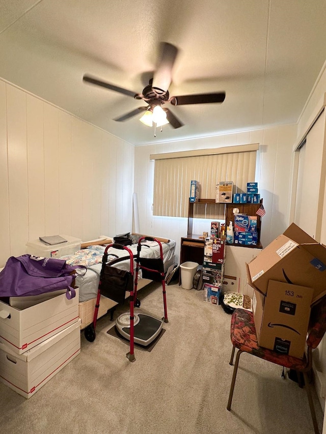 bedroom with light colored carpet and ceiling fan