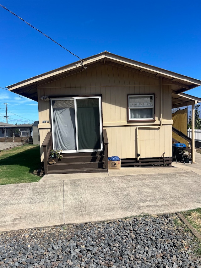 rear view of house with a carport