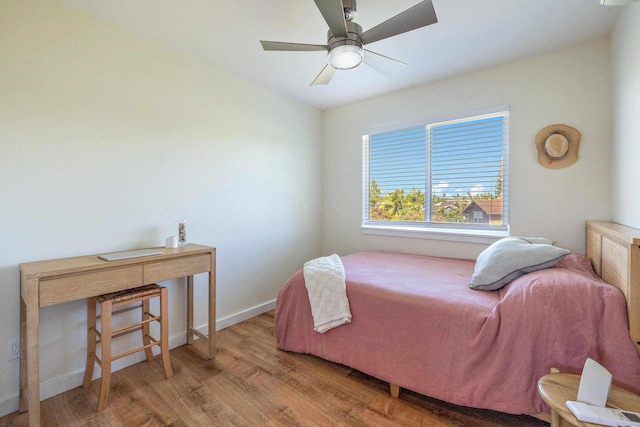 bedroom with ceiling fan and hardwood / wood-style floors