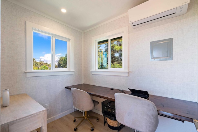 office area with plenty of natural light, electric panel, wood-type flooring, and an AC wall unit