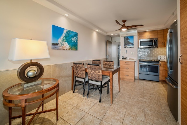 dining area featuring light tile patterned floors and ceiling fan