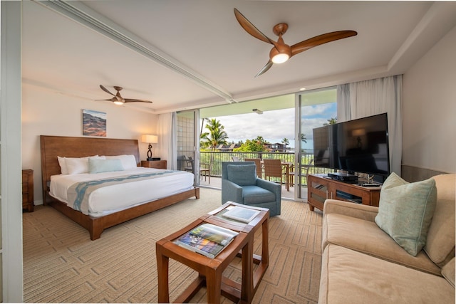 bedroom featuring a wall of windows, access to exterior, and ceiling fan