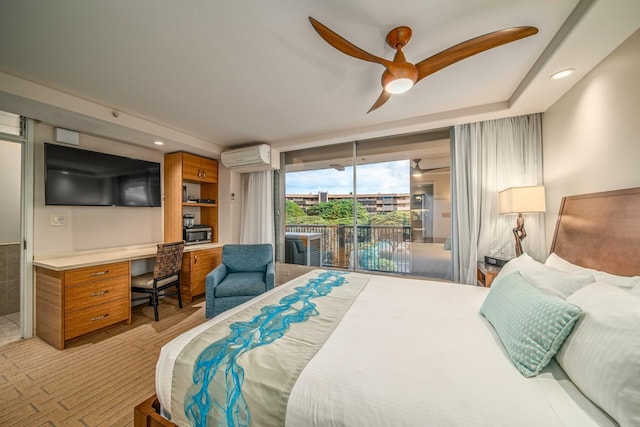 bedroom with ceiling fan, built in desk, access to outside, and a wall mounted AC