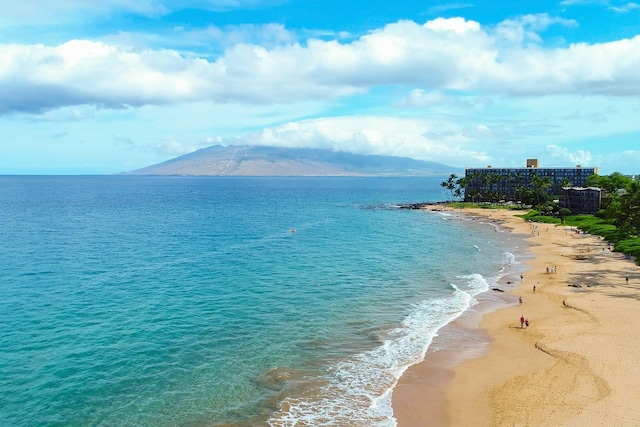 view of water feature featuring a mountain view and a beach view