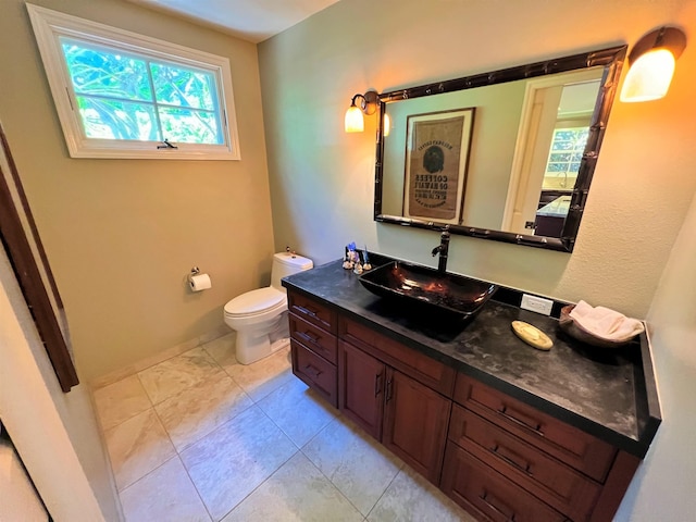 bathroom with toilet and vanity