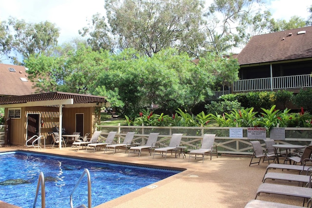 view of pool featuring a patio