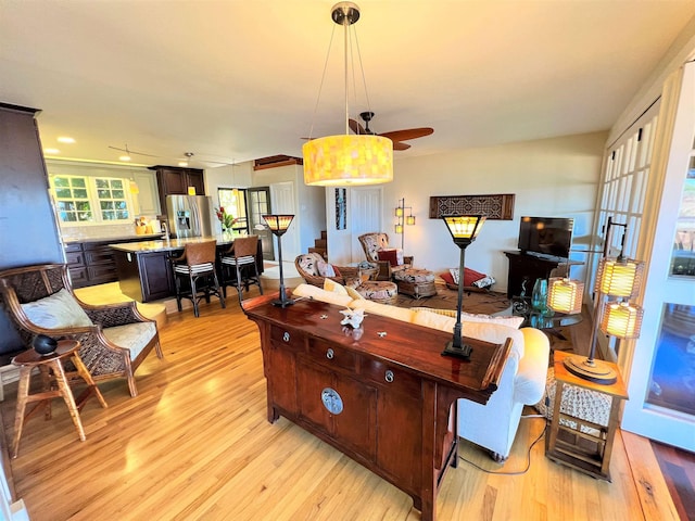 interior space featuring ceiling fan and light hardwood / wood-style floors