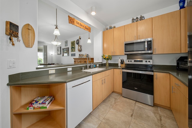 kitchen with pendant lighting, stainless steel appliances, sink, and kitchen peninsula