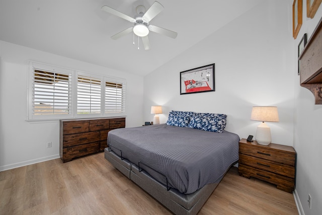 bedroom with lofted ceiling, light wood-type flooring, and ceiling fan