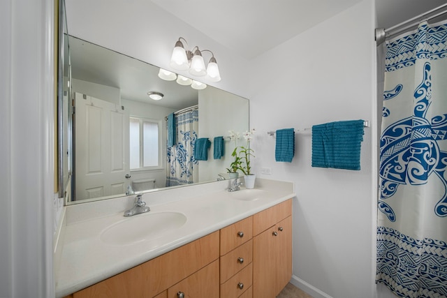 bathroom with vanity and curtained shower