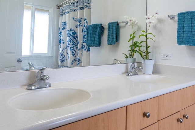 bathroom with vanity, plenty of natural light, and a shower with shower curtain